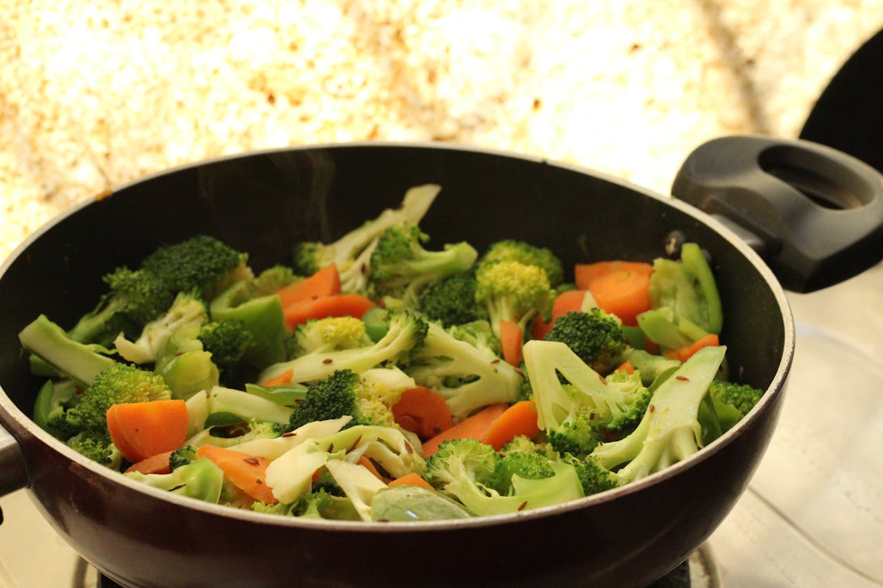 gallery-2 Close-up of vibrant stir-fried vegetables in a pan, perfect for healthy cooking.